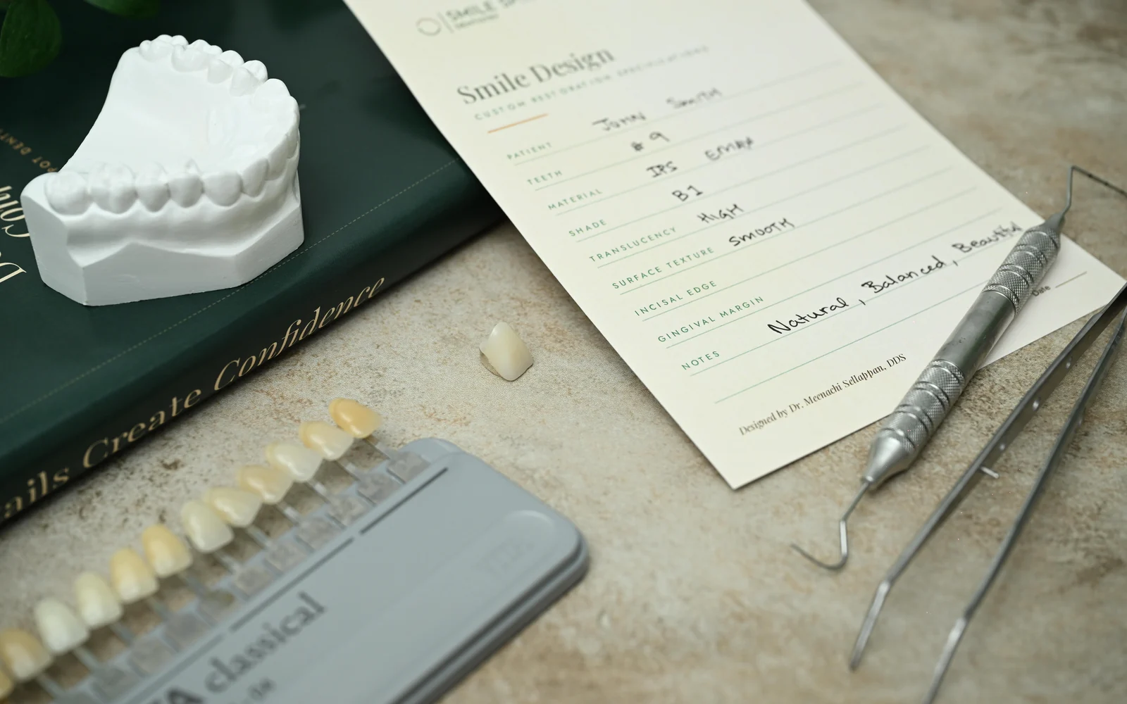 VITA shade guide, ceramic veneer, model and Dr. Sellappan's Smile Design prescription — Smile Spot Dentistry, Venice, FL