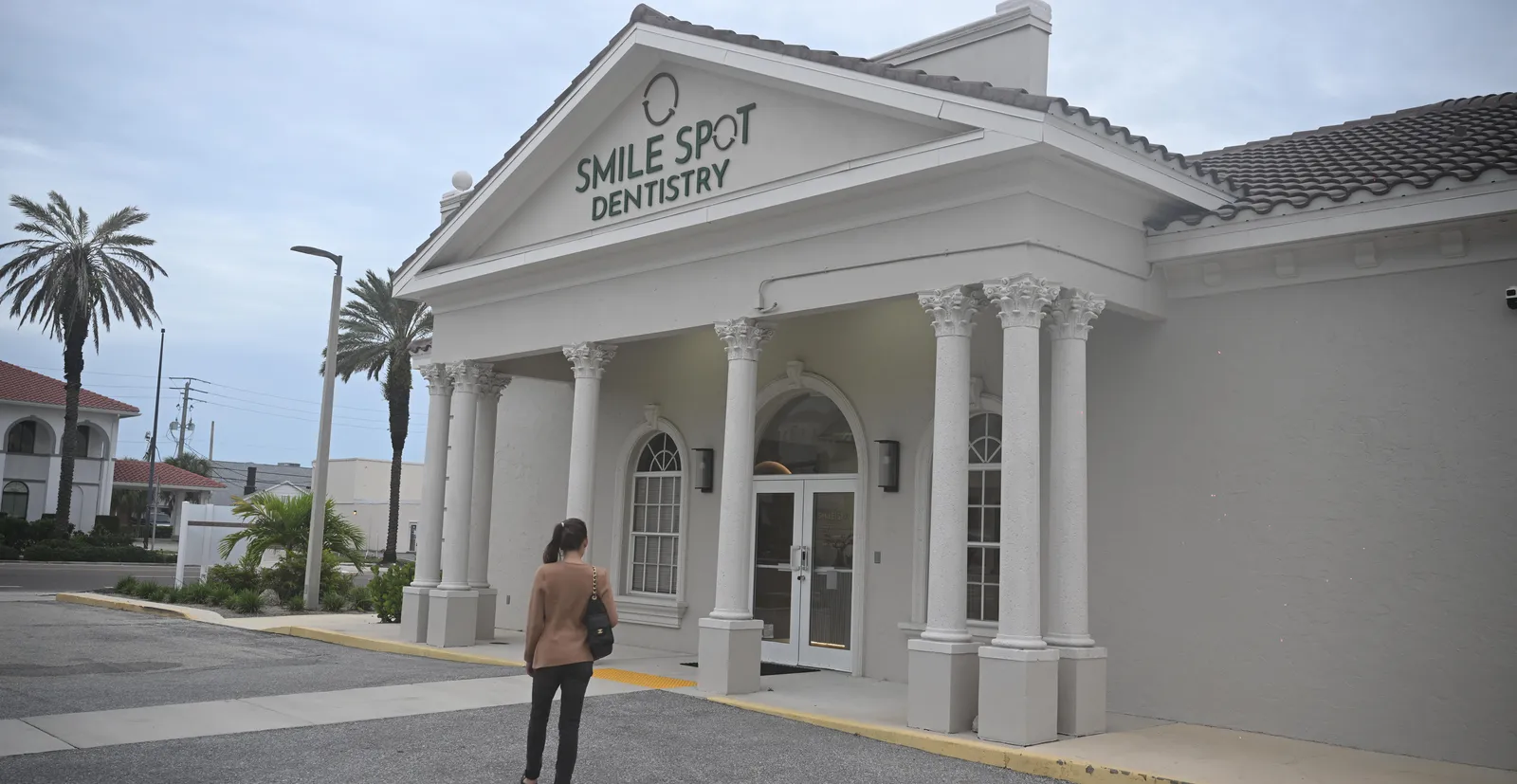 Arrival — patient walking up to the practice entrance, Tamiami Trail — Smile Spot Dentistry, Venice FL