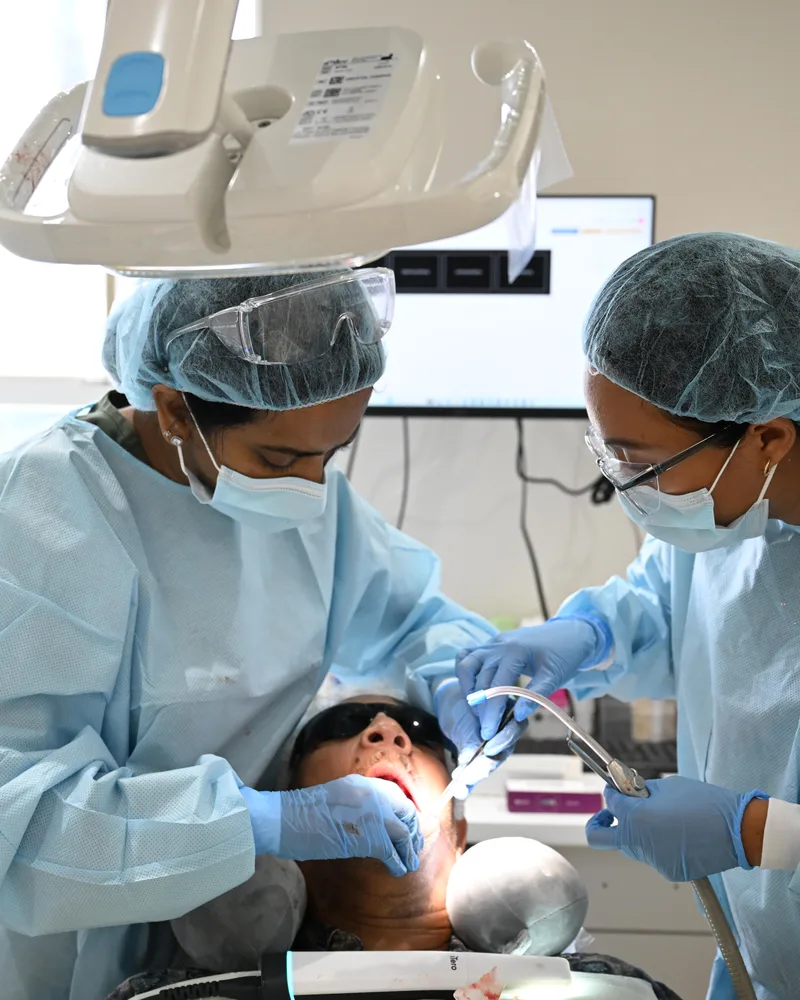 Dr. Sellappan placing implants in the surgical suite