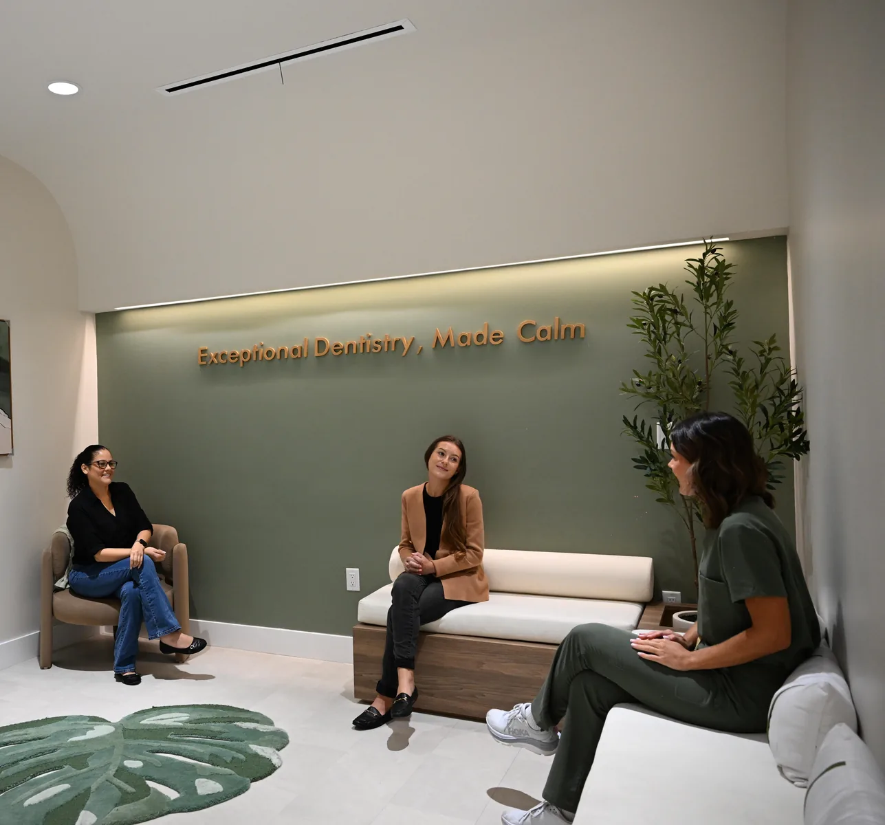 Patients relaxing and chatting in the Social Lounge at Smile Spot Dentistry, Venice, Florida