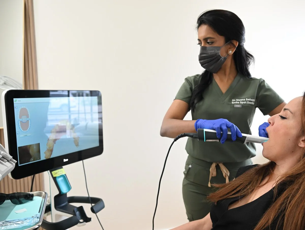 Dr. Meenachi Sellappan taking an iTero digital scan with the 3D model on screen — Smile Spot Dentistry, Venice FL
